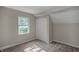 Bright bedroom featuring a window, closet, and neutral wall tones at 618 N Gladstone Ave, Indianapolis, IN 46201