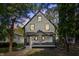 Two-story house with gray brick, updated porch and landscaping at 618 N Gladstone Ave, Indianapolis, IN 46201