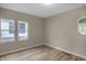 Bright bedroom featuring two windows and hardwood floors at 618 N Gladstone Ave, Indianapolis, IN 46201