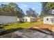 Spacious backyard with detached garages and a large concrete patio at 618 N Gladstone Ave, Indianapolis, IN 46201