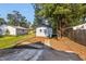 Backyard with shed, patio, and mature trees at 618 N Gladstone Ave, Indianapolis, IN 46201