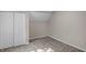 Simple bedroom with carpet, double door closet, and window at 618 N Gladstone Ave, Indianapolis, IN 46201