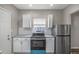 Modern kitchen with white cabinets and teal oven at 618 N Gladstone Ave, Indianapolis, IN 46201