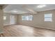 Spacious living room with light brown laminate floors at 618 N Gladstone Ave, Indianapolis, IN 46201