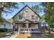 Renovated two-story house with gray and beige siding at 618 N Gladstone Ave, Indianapolis, IN 46201