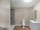 Basement bathroom with a shower, toilet and vanity at 618 N Gladstone Ave, Indianapolis, IN 46201