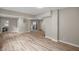 Open living area with laminate floors and laundry access at 618 N Gladstone Ave, Indianapolis, IN 46201