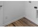 Laundry room with vinyl flooring and built-in shelving at 10626 Maidenhair Dr, Indianapolis, IN 46239