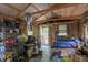 Small cabin bedroom with exposed beams and storage at 2077 E 500 S, Greenfield, IN 46140