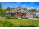 Two-story house with stone and siding exterior, double garage, and landscaping at 1750 Brookfield Dr, Columbus, IN 47201