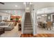 Elegant staircase leading to the upper level, overlooking living and dining areas at 1750 Brookfield Dr, Columbus, IN 47201