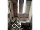 Bathroom needing renovation; features a damaged sink and tub at 3321 S Rybolt Ave, Indianapolis, IN 46221