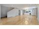 Open living area featuring hardwood floors and a kitchen island at 4513 Norwaldo Ave, Indianapolis, IN 46205