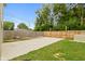 Large backyard with a wooden fence and a concrete patio at 4513 Norwaldo Ave, Indianapolis, IN 46205