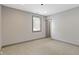Well-lit bedroom with window, carpet, and closet at 4513 Norwaldo Ave, Indianapolis, IN 46205