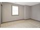Cozy bedroom with window, carpet, and neutral color palette at 4513 Norwaldo Ave, Indianapolis, IN 46205