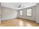 Bright bedroom with hardwood floors and ceiling fan at 4513 Norwaldo Ave, Indianapolis, IN 46205