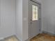 Gray front door with glass panels, interior view at 4513 Norwaldo Ave, Indianapolis, IN 46205
