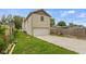 Detached garage with a large driveway and grassy area at 4513 Norwaldo Ave, Indianapolis, IN 46205
