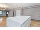 Large kitchen island with white quartz countertop, perfect for casual dining at 4513 Norwaldo Ave, Indianapolis, IN 46205