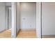 Convenient laundry room with wood flooring and built-in shelving at 4513 Norwaldo Ave, Indianapolis, IN 46205