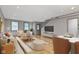 Open living and dining area with hardwood floors and modern furniture at 4513 Norwaldo Ave, Indianapolis, IN 46205