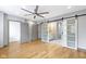 Spacious bedroom with hardwood floors and barn door to en-suite bathroom at 4513 Norwaldo Ave, Indianapolis, IN 46205