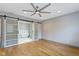 Spacious bedroom with hardwood floors and barn door to en-suite bathroom at 4513 Norwaldo Ave, Indianapolis, IN 46205