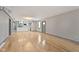 Spacious living room with hardwood floors and a modern kitchen at 4513 Norwaldo Ave, Indianapolis, IN 46205