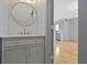 Stylish powder room with a modern vanity and gold fixtures at 4513 Norwaldo Ave, Indianapolis, IN 46205