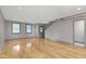 Living room with hardwood floors and two windows at 4513 Norwaldo Ave, Indianapolis, IN 46205