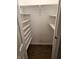 Empty pantry with white shelves and wood floor at 14 Winchester Ct, Anderson, IN 46013
