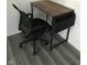 Home office with a desk and black rolling chair at 3654 Newgate Ln, Indianapolis, IN 46235