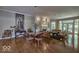 Elegant living room with hardwood floors and large windows at 6470 Meridian Pkwy # Apt D, Indianapolis, IN 46220