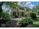 Home features a large backyard with patio and lush landscaping at 6470 Meridian Pkwy # Apt D, Indianapolis, IN 46220
