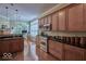 Bright kitchen boasts an island, stainless steel appliances, and hardwood floors at 6470 Meridian Pkwy # Apt D, Indianapolis, IN 46220