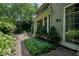 Brick patio with lush landscaping and access to the home at 6470 Meridian Pkwy # Apt D, Indianapolis, IN 46220