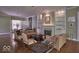 Comfortable living room with a fireplace and built-in shelving at 6470 Meridian Pkwy # Apt D, Indianapolis, IN 46220