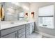 Clean bathroom with a double vanity and a large mirror at 16311 Taconite Dr, Noblesville, IN 46060