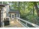 Wooden deck with built-in grill and wooded views at 6235 Johnson Rd, Indianapolis, IN 46220