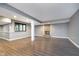 Finished basement featuring LVP flooring, a fireplace, and large windows at 6235 Johnson Rd, Indianapolis, IN 46220