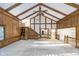 Large living room with hardwood floors, vaulted ceilings, and a wet bar at 6235 Johnson Rd, Indianapolis, IN 46220