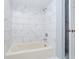 Bathroom with bathtub and marble-look tile at 6235 Johnson Rd, Indianapolis, IN 46220