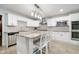 Modern kitchen with white cabinets, granite countertops, and stainless steel appliances at 6235 Johnson Rd, Indianapolis, IN 46220