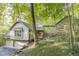 Beautiful home nestled in a wooded setting with brick and siding at 6235 Johnson Rd, Indianapolis, IN 46220