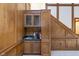 Built-in wet bar with cabinets and a sink at 6235 Johnson Rd, Indianapolis, IN 46220