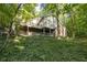 Multi-level home nestled in a lush wooded setting at 6235 Johnson Rd, Indianapolis, IN 46220