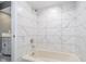 Clean bathroom with marble tile shower and bathtub at 6235 Johnson Rd, Indianapolis, IN 46220