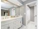 Bathroom with double vanity, marble countertops, and a shower/tub combo at 6235 Johnson Rd, Indianapolis, IN 46220