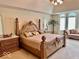 Large main bedroom with a king-size bed and an en-suite bathroom at 5300 W Autumn Springs Ct, Muncie, IN 47304